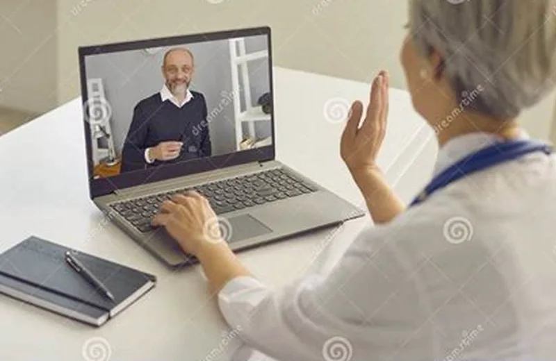 A woman in her late forties consulting an HRT clinician through a laptop video visit